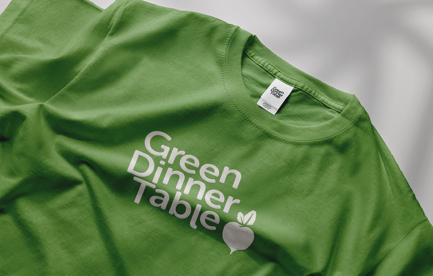 Green Dinner Table logo on tee design — Sinclair Creative Agency